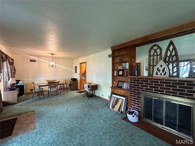 611 S Center, Shelbina, MO 63468 - carpeted living area featuring a brick fireplace, a chandelier, and baseboards
