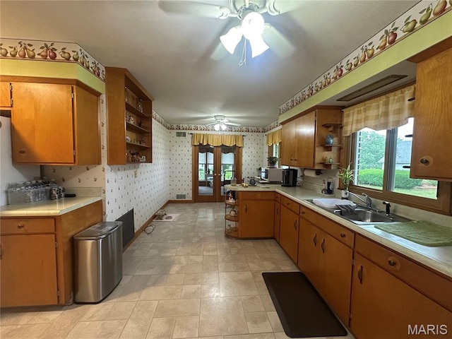 611 S Center, Shelbina, MO 63468 - kitchen with open shelves, ceiling fan, wallpapered walls, light countertops, and french doors