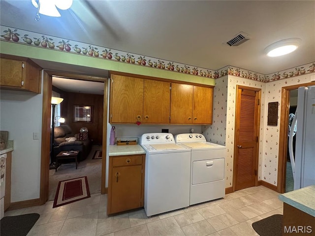 611 S Center, Shelbina, MO 63468 - washroom with cabinet space, wallpapered walls, separate washer and dryer, and baseboards