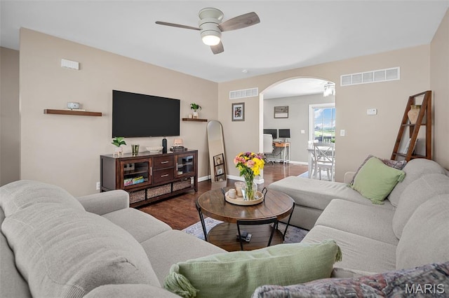 699 Olivia Ct, New Haven, MO 63068 - living area featuring arched walkways, ceiling fan, and wood finished floors