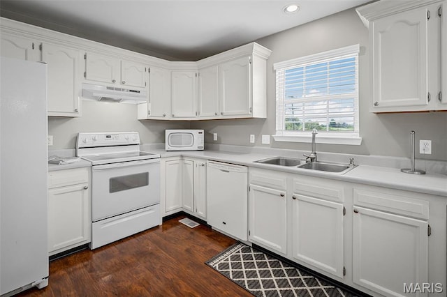 699 Olivia Ct, New Haven, MO 63068 - kitchen with white appliances, under cabinet range hood, recessed lighting, white cabinetry, and dark wood finished floors