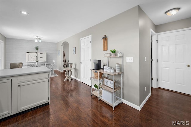 699 Olivia Ct, New Haven, MO 63068 - kitchen featuring arched walkways, dark wood-style floors, light countertops, recessed lighting, and white cabinets