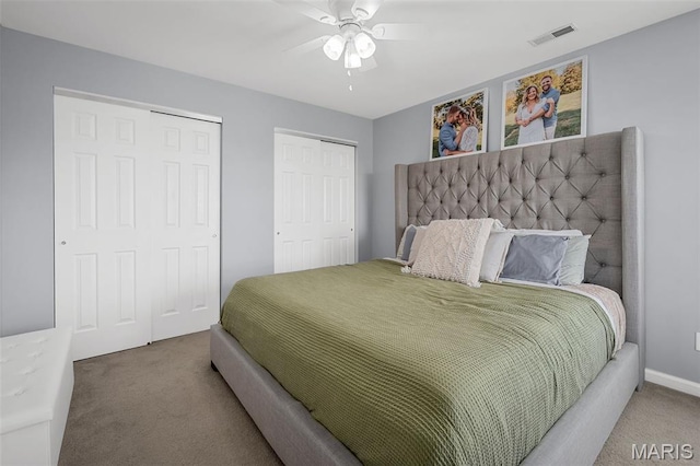 699 Olivia Ct, New Haven, MO 63068 - bedroom featuring carpet floors, two closets, and ceiling fan