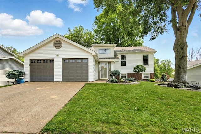 2342 Cedar Dale Ct, Maryland Heights, MO 63043 - tri-level home featuring a garage, concrete driveway, and a front lawn
