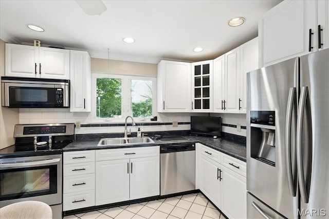 2342 Cedar Dale Ct, Maryland Heights, MO 63043 - kitchen with appliances with stainless steel finishes, a sink, dark countertops, white cabinets, and recessed lighting