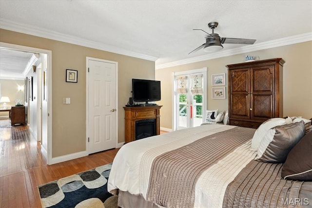 2342 Cedar Dale Ct, Maryland Heights, MO 63043 - bedroom featuring hardwood / wood-style floors, ornamental molding, baseboards, a fireplace, and access to exterior