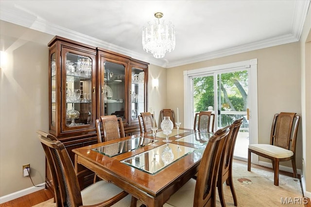 2342 Cedar Dale Ct, Maryland Heights, MO 63043 - dining space with a chandelier, baseboards, and crown molding