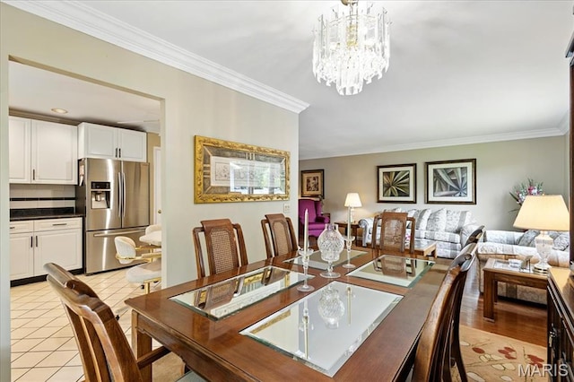 2342 Cedar Dale Ct, Maryland Heights, MO 63043 - dining room with ornamental molding and a chandelier