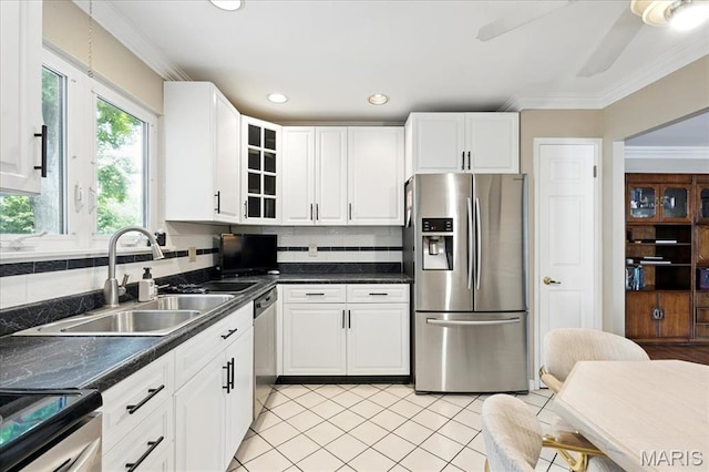 2342 Cedar Dale Ct, Maryland Heights, MO 63043 - kitchen with appliances with stainless steel finishes, a sink, white cabinetry, dark countertops, and light tile patterned floors