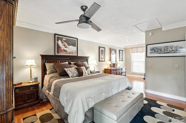2342 Cedar Dale Ct, Maryland Heights, MO 63043 - bedroom with light wood finished floors, crown molding, a textured ceiling, attic access, and a ceiling fan