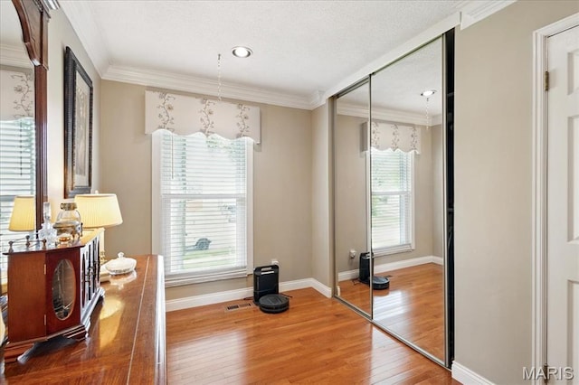 2342 Cedar Dale Ct, Maryland Heights, MO 63043 - home office featuring wood finished floors, baseboards, ornamental molding, and recessed lighting
