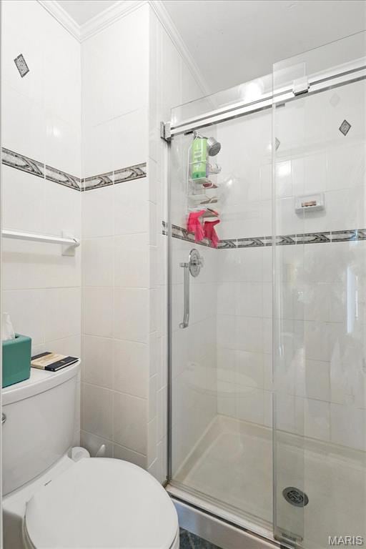 2342 Cedar Dale Ct, Maryland Heights, MO 63043 - bathroom featuring toilet, crown molding, and a stall shower