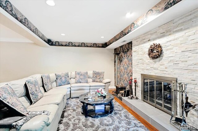 2342 Cedar Dale Ct, Maryland Heights, MO 63043 - living room with wood finished floors, a fireplace, recessed lighting, and baseboards