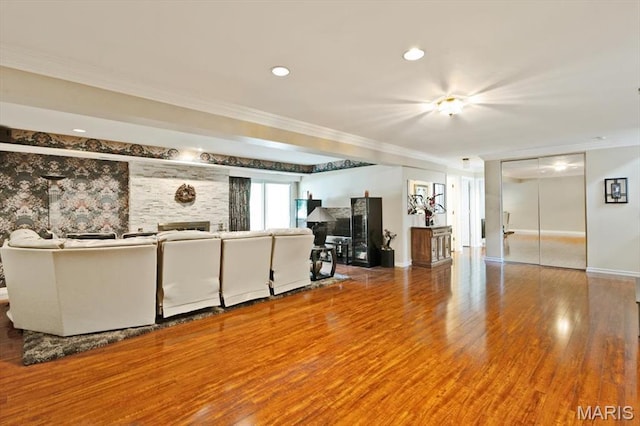 2342 Cedar Dale Ct, Maryland Heights, MO 63043 - living room with ornamental molding, baseboards, wood finished floors, and a fireplace