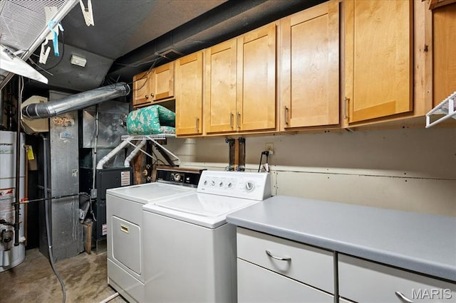 2342 Cedar Dale Ct, Maryland Heights, MO 63043 - laundry room with washing machine and clothes dryer, cabinet space, and gas water heater