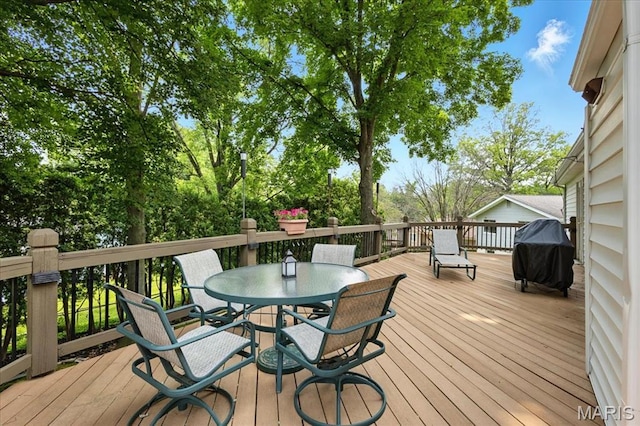 2342 Cedar Dale Ct, Maryland Heights, MO 63043 - wooden deck with area for grilling and outdoor dining space
