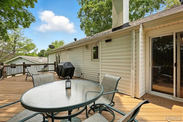 2342 Cedar Dale Ct, Maryland Heights, MO 63043 - wooden deck with area for grilling and outdoor dining area