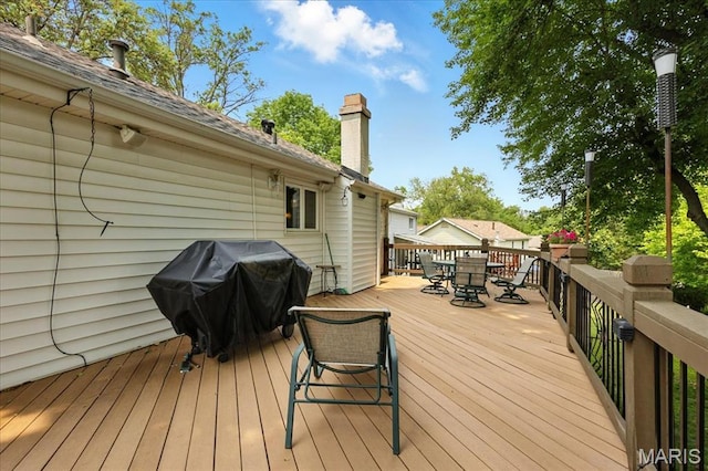 2342 Cedar Dale Ct, Maryland Heights, MO 63043 - wooden deck with outdoor dining area and area for grilling