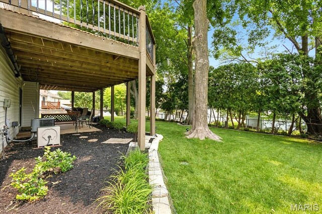 2342 Cedar Dale Ct, Maryland Heights, MO 63043 - view of yard featuring a patio area and a wooden deck