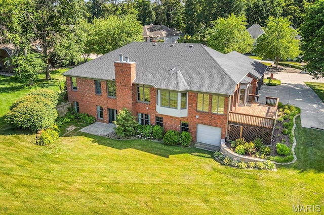 1609 10th Fairway Dr, Belleville, IL 62220 - back of property with brick siding, a chimney, a shingled roof, and a yard