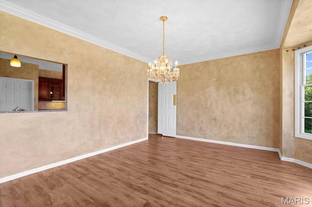 1609 10th Fairway Dr, Belleville, IL 62220 - empty room with wood finished floors, a chandelier, and crown molding