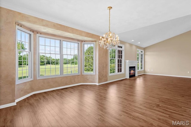 1609 10th Fairway Dr, Belleville, IL 62220 - unfurnished living room with wood finished floors, a chandelier, a lit fireplace, and vaulted ceiling