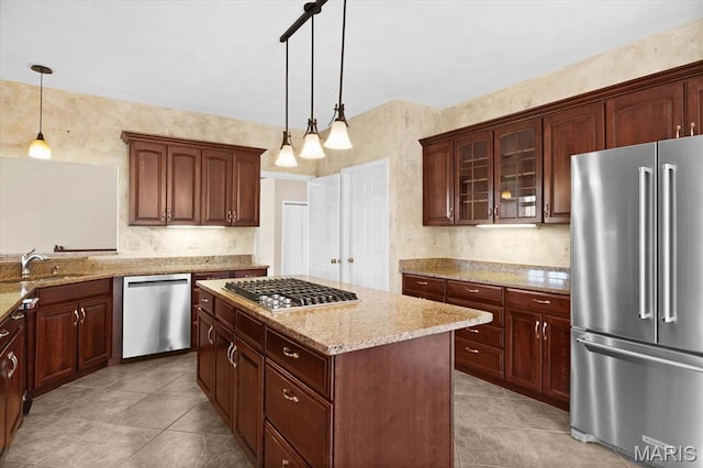 1609 10th Fairway Dr, Belleville, IL 62220 - kitchen featuring stainless steel appliances, light tile patterned flooring, light stone countertops, a kitchen island, and glass insert cabinets