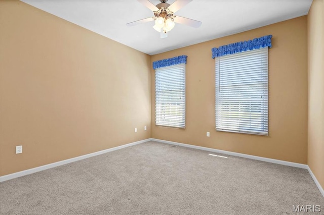 1609 10th Fairway Dr, Belleville, IL 62220 - carpeted spare room featuring baseboards and ceiling fan