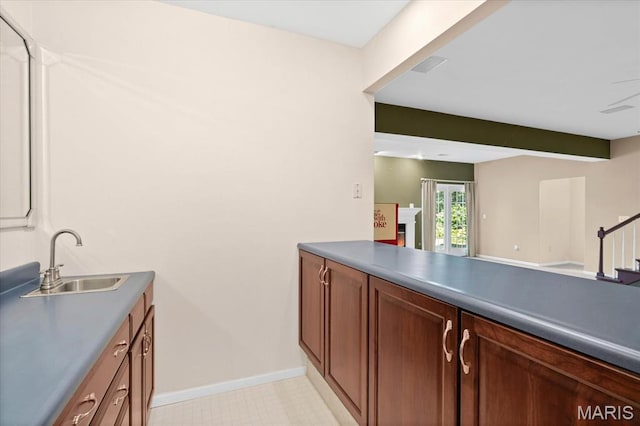 1609 10th Fairway Dr, Belleville, IL 62220 - laundry room featuring a sink and a warm lit fireplace