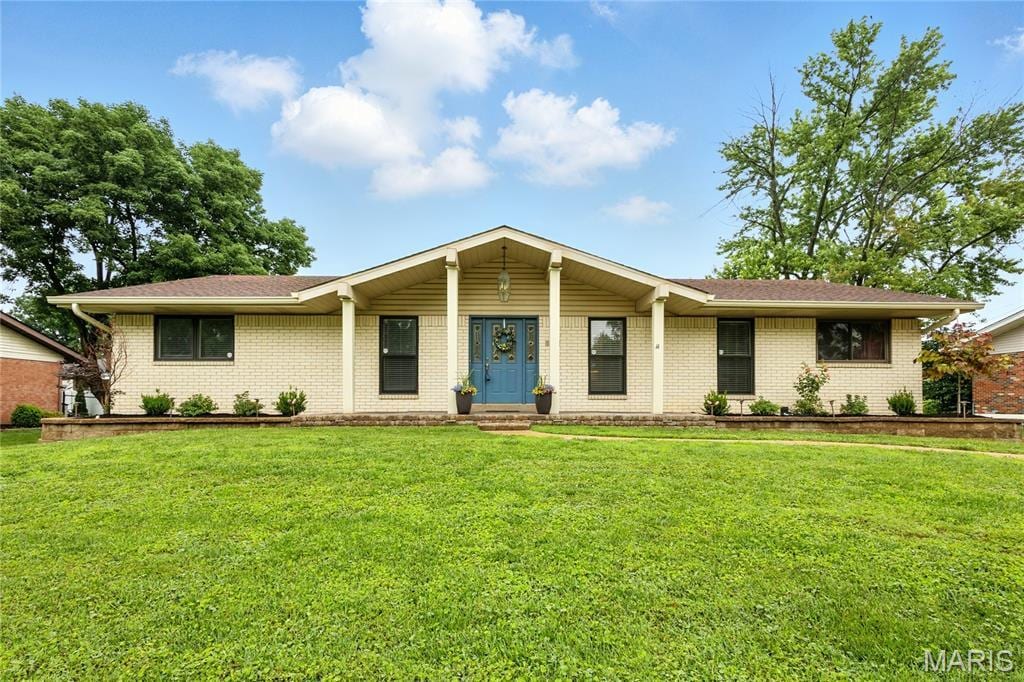 5839 Pebble Oak Dr, Saint Louis, MO 63128 - ranch-style house with brick siding and a front yard
