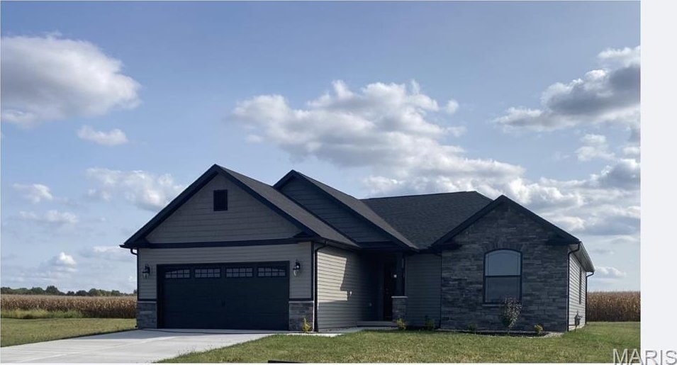 906 Brianna Ct, Jerseyville, IL 62052 - craftsman-style home featuring stone siding, driveway, a garage, and a front yard