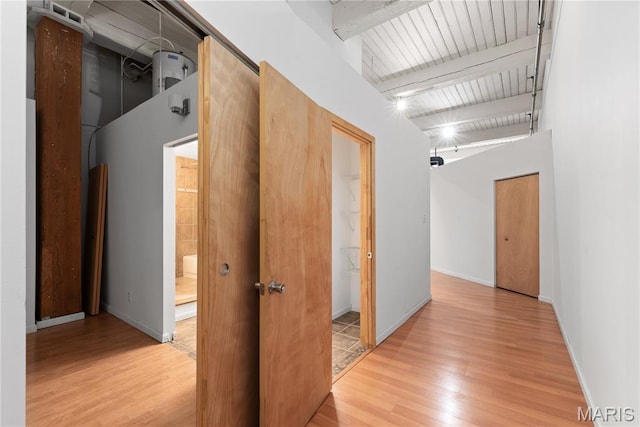 507 N 13th St Unit 207, Saint Louis, MO 63103 - hall with light wood-style flooring and beam ceiling