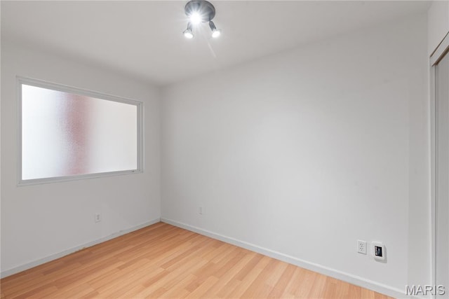 507 N 13th St Unit 207, Saint Louis, MO 63103 - unfurnished room with wood finished floors and baseboards