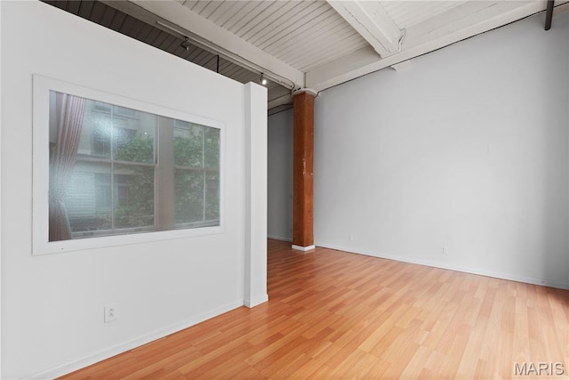507 N 13th St Unit 207, Saint Louis, MO 63103 - unfurnished room featuring beamed ceiling and wood finished floors
