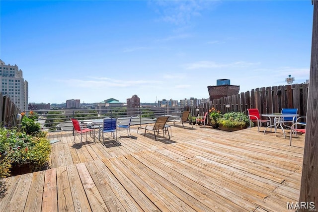 507 N 13th St Unit 207, Saint Louis, MO 63103 - wooden terrace featuring outdoor dining area and a city view