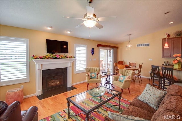 426 Vancroft Pl, Ofallon, IL 62269 - living area featuring a fireplace with flush hearth, a ceiling fan, light wood-style floors, lofted ceiling, and recessed lighting