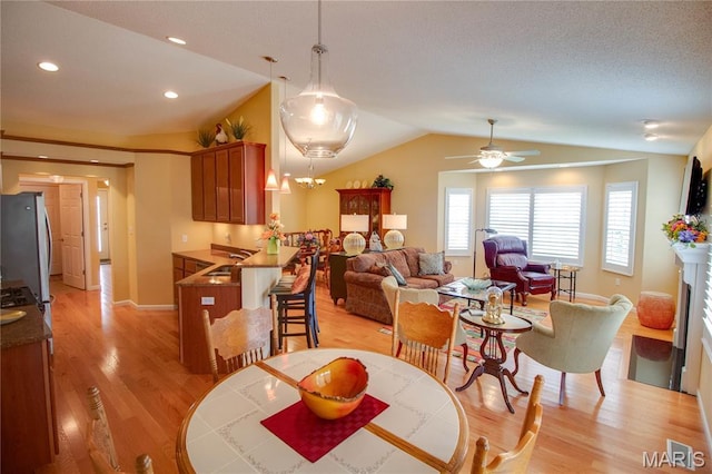 426 Vancroft Pl, Ofallon, IL 62269 - dining space featuring vaulted ceiling, light wood-type flooring, ceiling fan, and recessed lighting