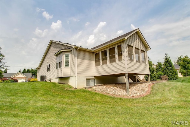 426 Vancroft Pl, Ofallon, IL 62269 - rear view of house featuring a yard and a sunroom