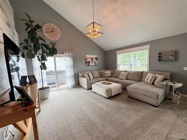 123 Clover Rd, Hannibal, MO 63401 - carpeted living area with high vaulted ceiling and a chandelier