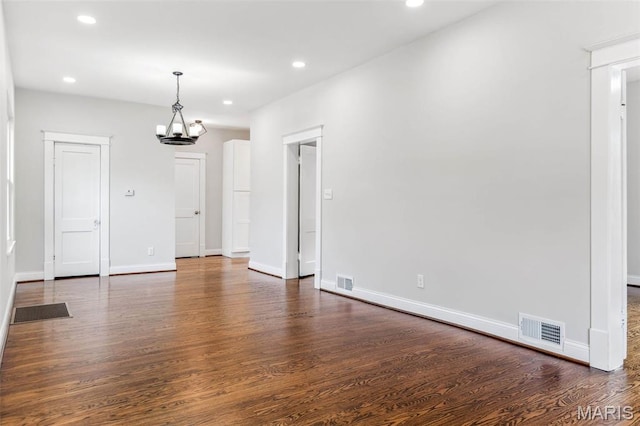 7721 Weaver Ave, Maplewood, MO 63143 - spare room with wood finished floors, recessed lighting, a chandelier, and baseboards