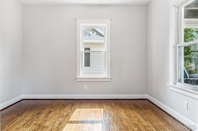 7721 Weaver Ave, Maplewood, MO 63143 - empty room featuring baseboards and wood finished floors