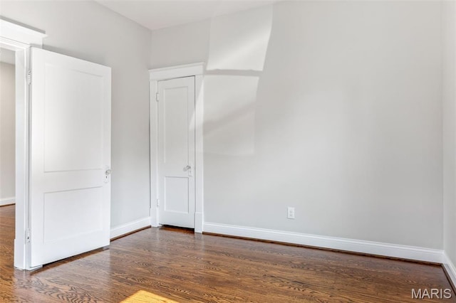 7721 Weaver Ave, Maplewood, MO 63143 - unfurnished bedroom featuring wood finished floors and baseboards
