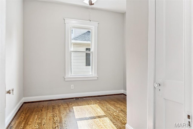 7721 Weaver Ave, Maplewood, MO 63143 - empty room with wood finished floors and baseboards