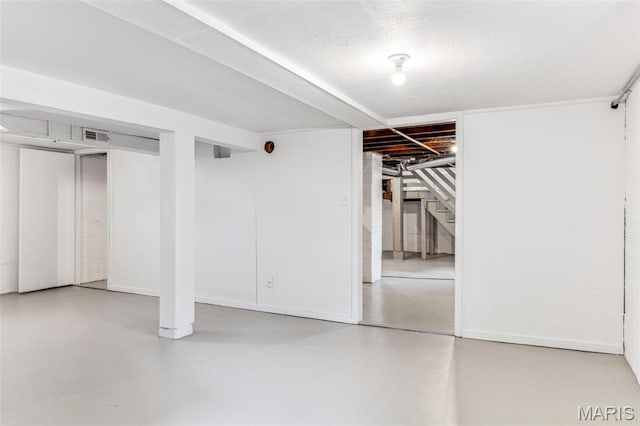 7721 Weaver Ave, Maplewood, MO 63143 - finished basement featuring stairway and baseboards