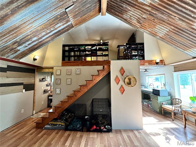 29048 State Highway V, Maywood, MO 63454 - staircase with high vaulted ceiling and wood finished floors