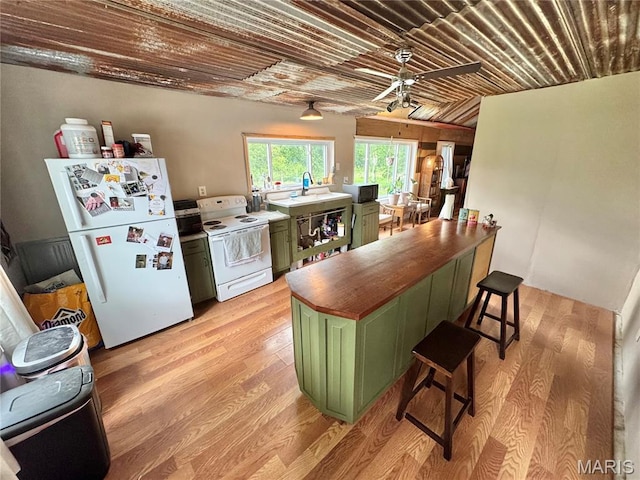 29048 State Highway V, Maywood, MO 63454 - kitchen with green cabinetry, white appliances, light wood-style floors, wood counters, and ceiling fan