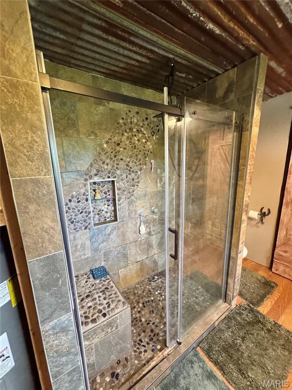 29048 State Highway V, Maywood, MO 63454 - full bath with a stall shower, toilet, and wood finished floors