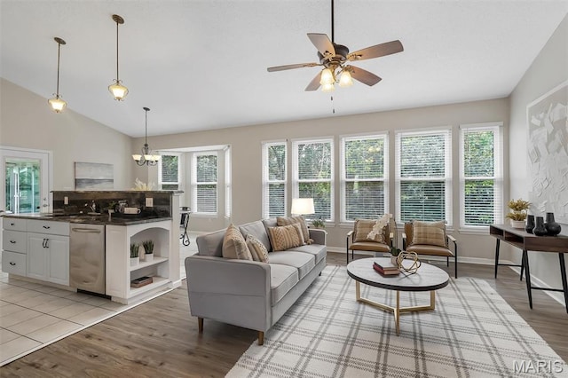3001 Peach Blossom Ct, High Ridge, MO 63049 - living area featuring light wood-style floors, ceiling fan, healthy amount of natural light, a chandelier, and lofted ceiling