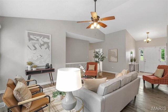 3001 Peach Blossom Ct, High Ridge, MO 63049 - living area featuring wood finished floors, ceiling fan, a chandelier, and high vaulted ceiling
