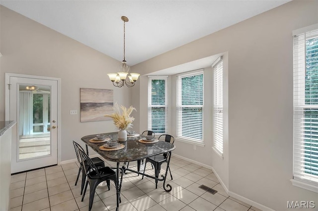 3001 Peach Blossom Ct, High Ridge, MO 63049 - dining space with plenty of natural light, light tile patterned floors, lofted ceiling, and a chandelier